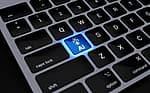 a computer keyboard with a blue light on it